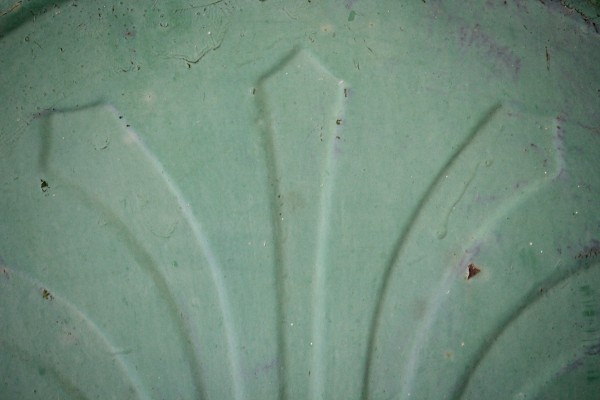 Raised Arrow Design on Grungy Old Green Metal Texture