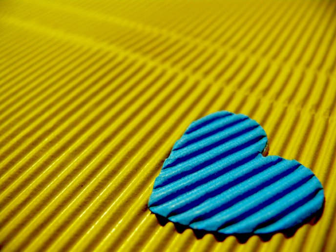 Blue Heart on a Yellow Background