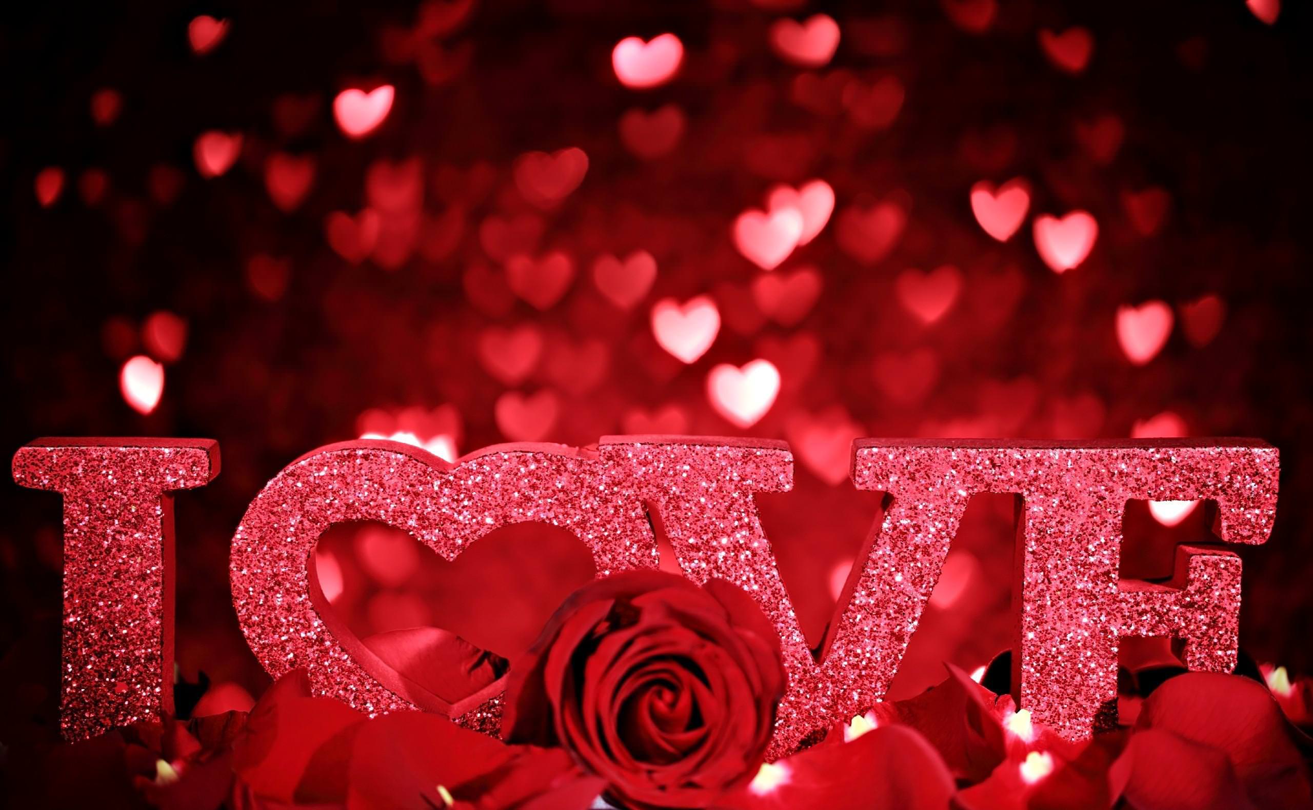 Glittery Love Symbol on Red Color Background