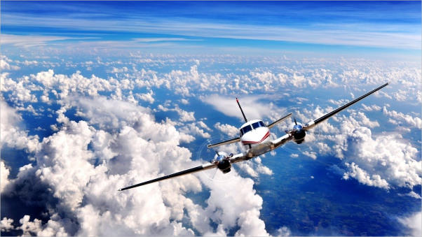 Plane Flying in Blue Sky Background