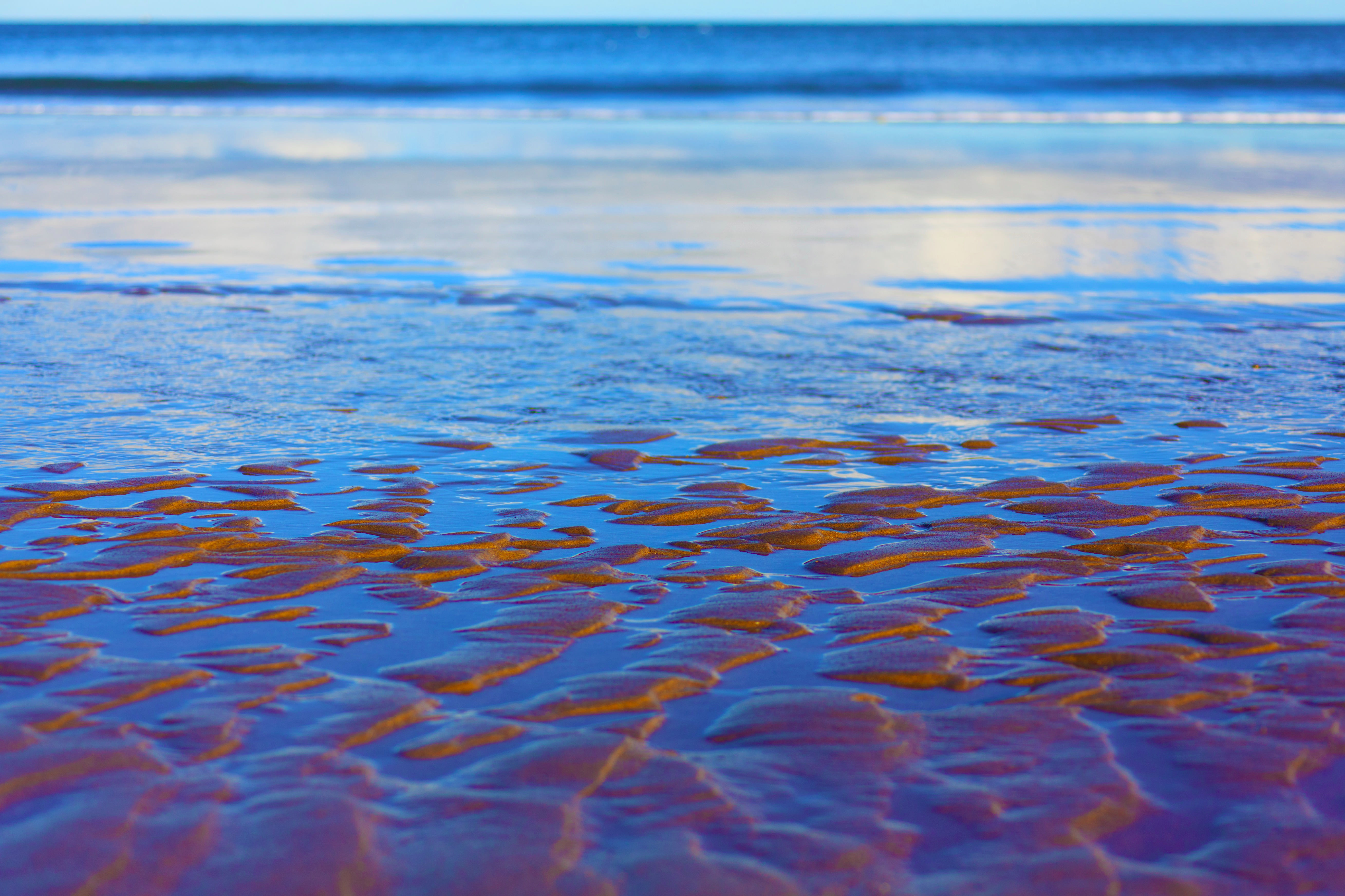 Sand Texture in Blue Sea Background