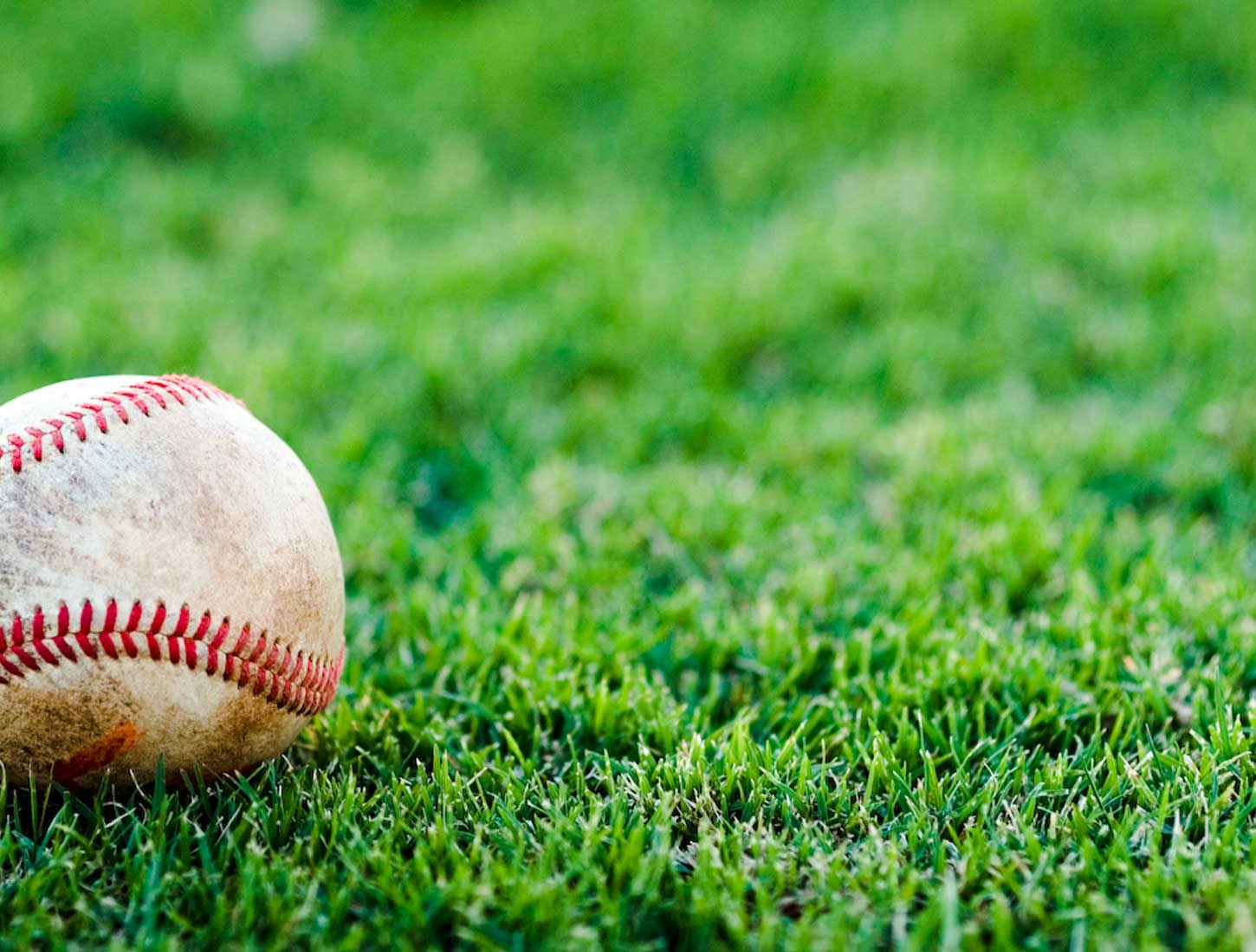 Baseball on Green Grass Wallpaper