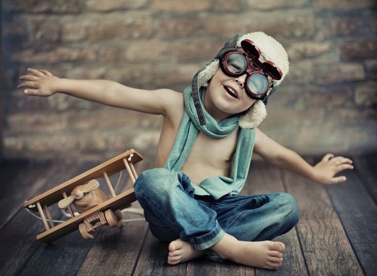 Boy with Toy Airplane Wallpaper