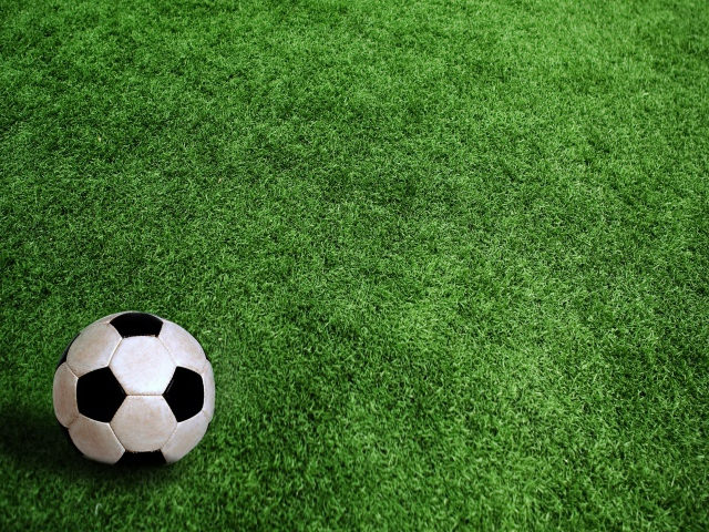 Football on Grass Feild Background
