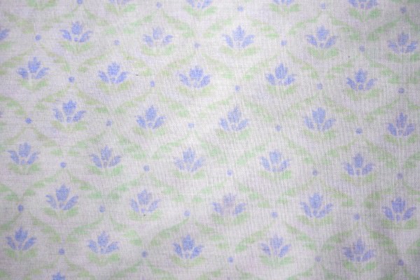 White Fabric with Blue Floral Pattern Texture Background