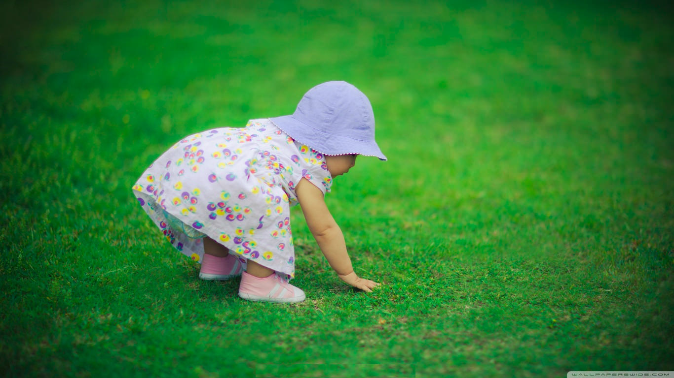 Cute Baby Girl Playing Wallpaper