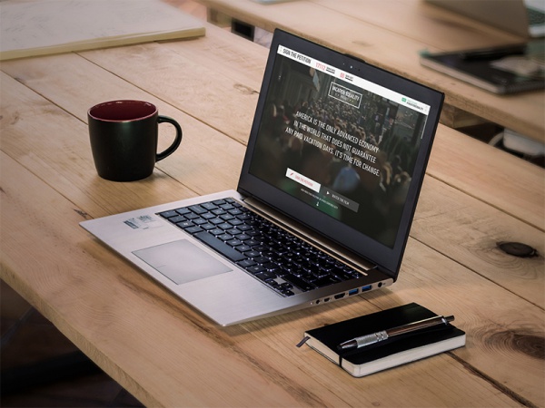 Laptop on Wooden Desk Mockup