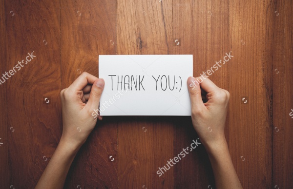 Man Holding Thank You Banner